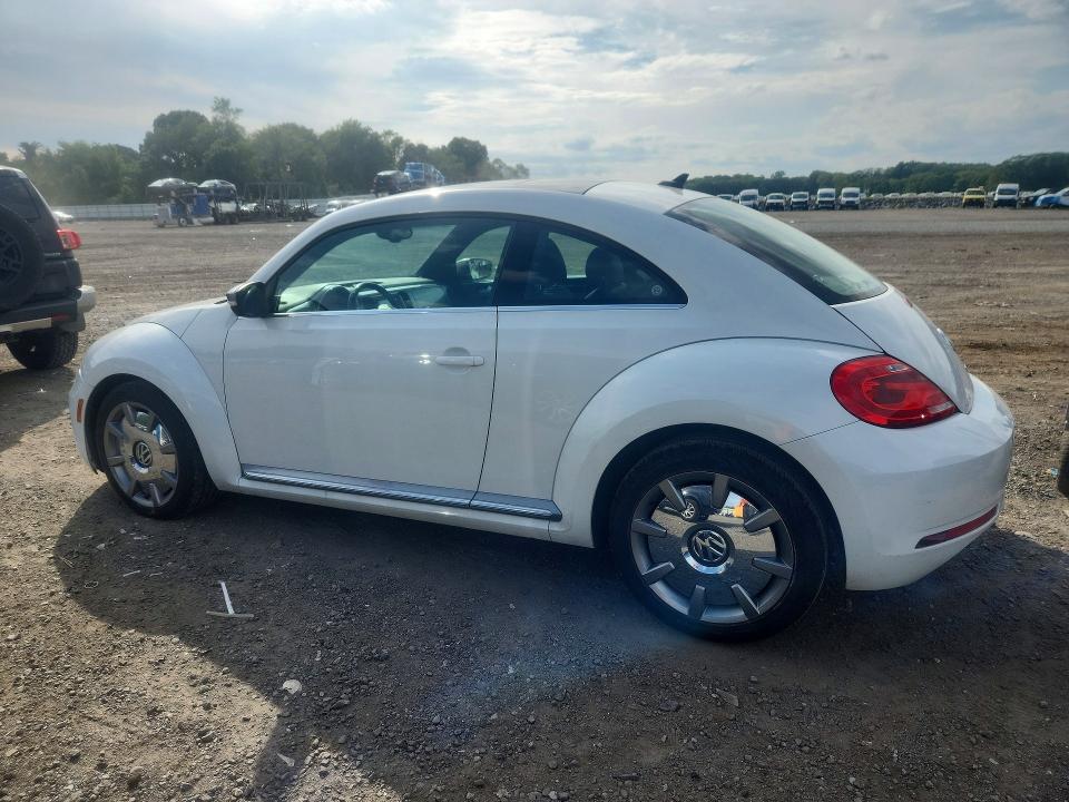 Photo 2 from auction – 2014 VOLKSWAGEN BEETLE with VIN 3VWJL7AT8EM653397
