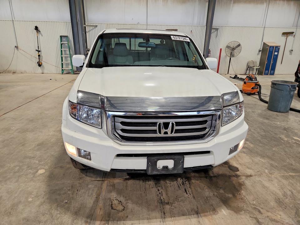 Photo 5 from auction – 2012 HONDA RIDGELINE with VIN 5FPYK1F52CB001699