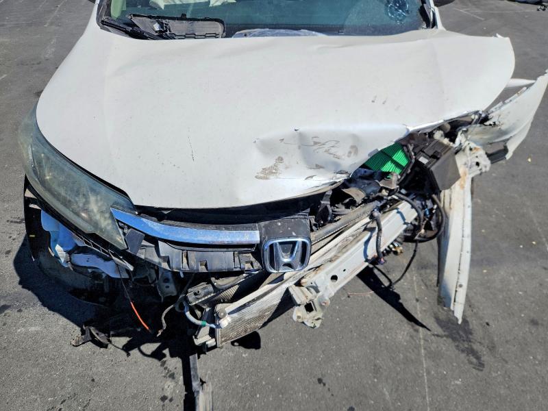 Photo 11 from auction – 2015 HONDA CR-V with VIN 5J6RM4H35FL024572