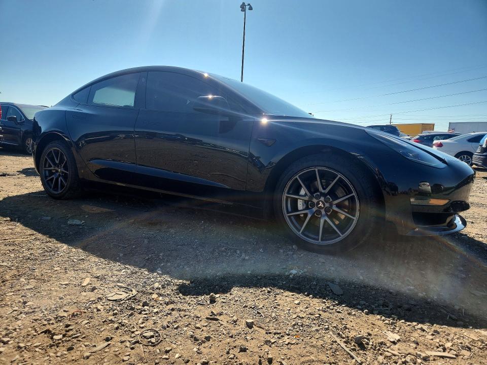 Photo 4 from auction – 2022 TESLA MODEL 3 with VIN 5YJ3E1EB9NF119057