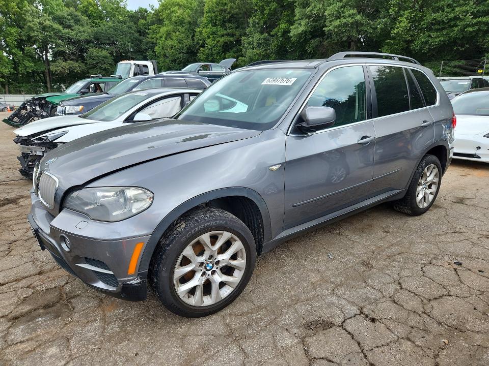 BMW X5 2013 with VIN 5UXZV4C59D0B09765 - Photo from auction