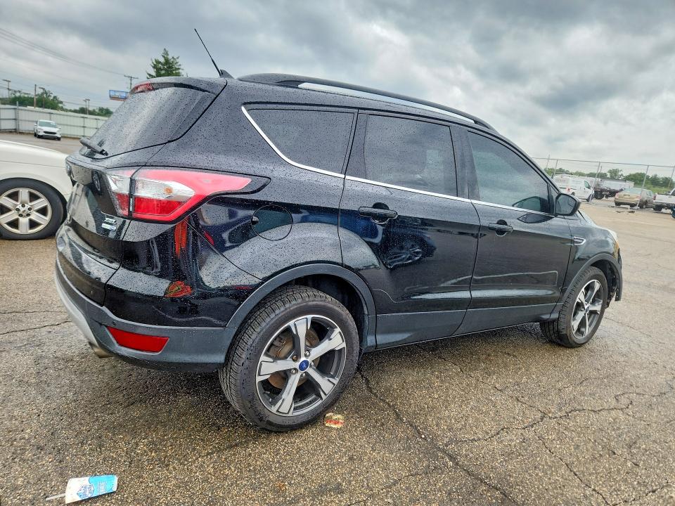 Photo 3 from auction – 2018 FORD ESCAPE with VIN 1FMCU9HD5JUB51080