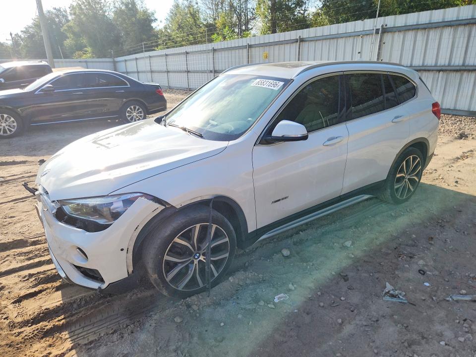 BMW X1 2017 with VIN WBXHT3C30H5F70537 - Photo from auction