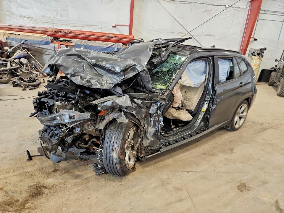 BMW X1 2014 with VIN WBAVM5C52EVV93298 - Photo from auction