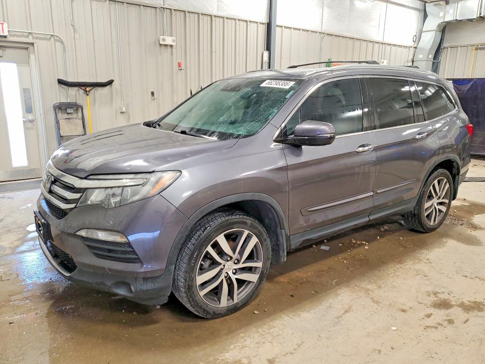 HONDA PILOT 2016 с VIN 5FNYF6H95GB103725 - Фото с аукциона
