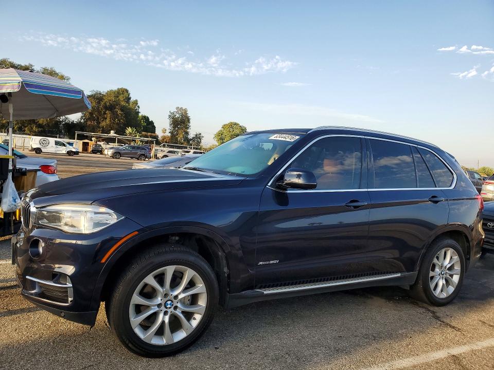 BMW X5 2014 with VIN 5UXKR0C51E0H24052 - Photo from auction