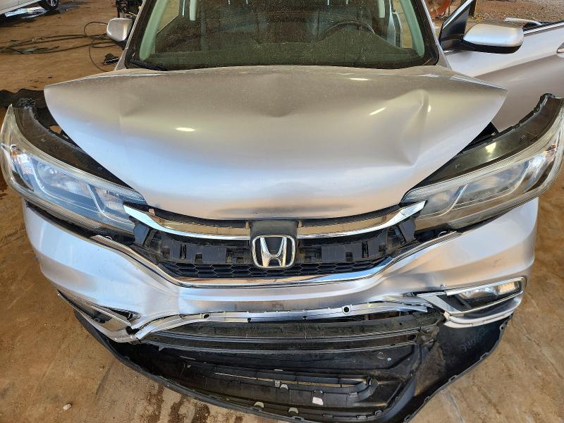 Photo 12 from auction – 2016 HONDA CR-V with VIN 2HKRM3H79GH559283