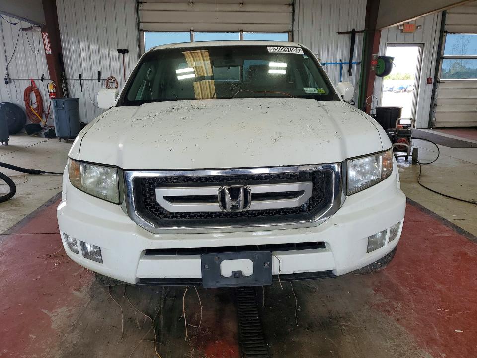 Photo 5 from auction – 2011 HONDA RIDGELINE with VIN 5FPYK1F50BB004440