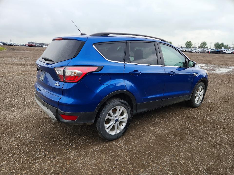 Photo 3 from auction – 2018 FORD ESCAPE with VIN 1FMCU9GD4JUA26007