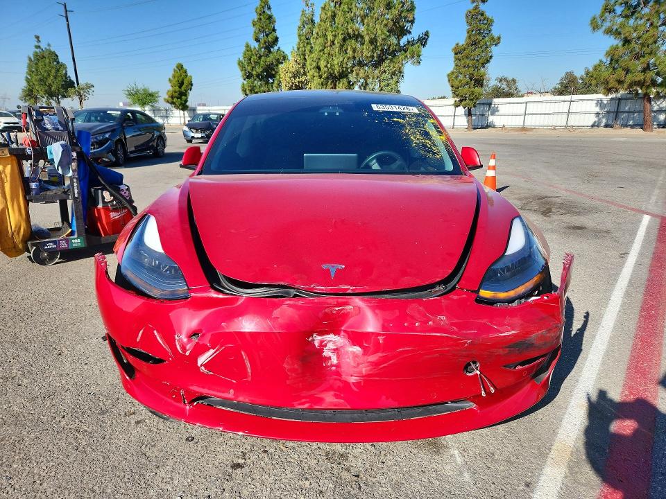 Photo 5 from auction – 2021 TESLA MODEL 3 with VIN 5YJ3E1EB1MF998584