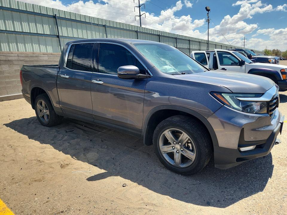 Photo 4 from auction – 2022 HONDA RIDGELINE with VIN 5FPYK3F78NB014831