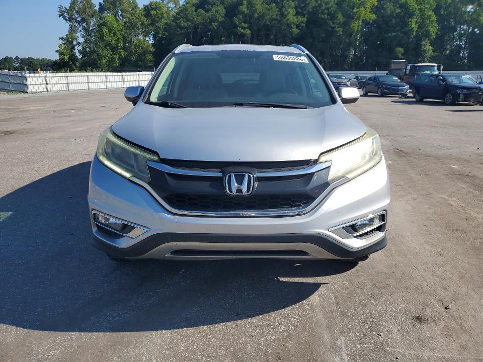 Photo 5 from auction – 2015 HONDA CR-V with VIN 2HKRM3H73FH504777