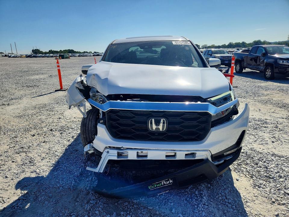 Photo 5 from auction – 2023 HONDA PASSPORT with VIN 5FNYF8H56PB001844