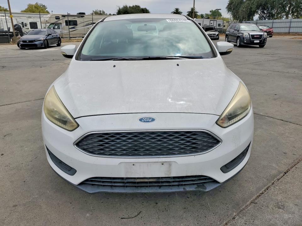 Photo 5 from auction – 2016 FORD FOCUS with VIN 1FADP3F20GL320022