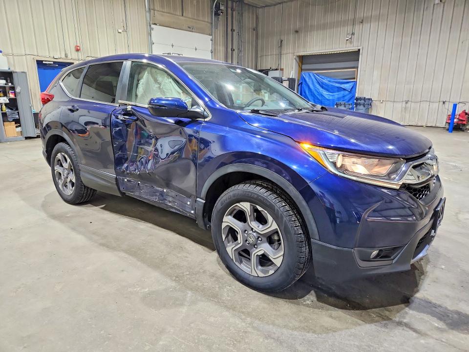Photo 4 from auction – 2018 HONDA CR-V with VIN 7FARW2H53JE058094