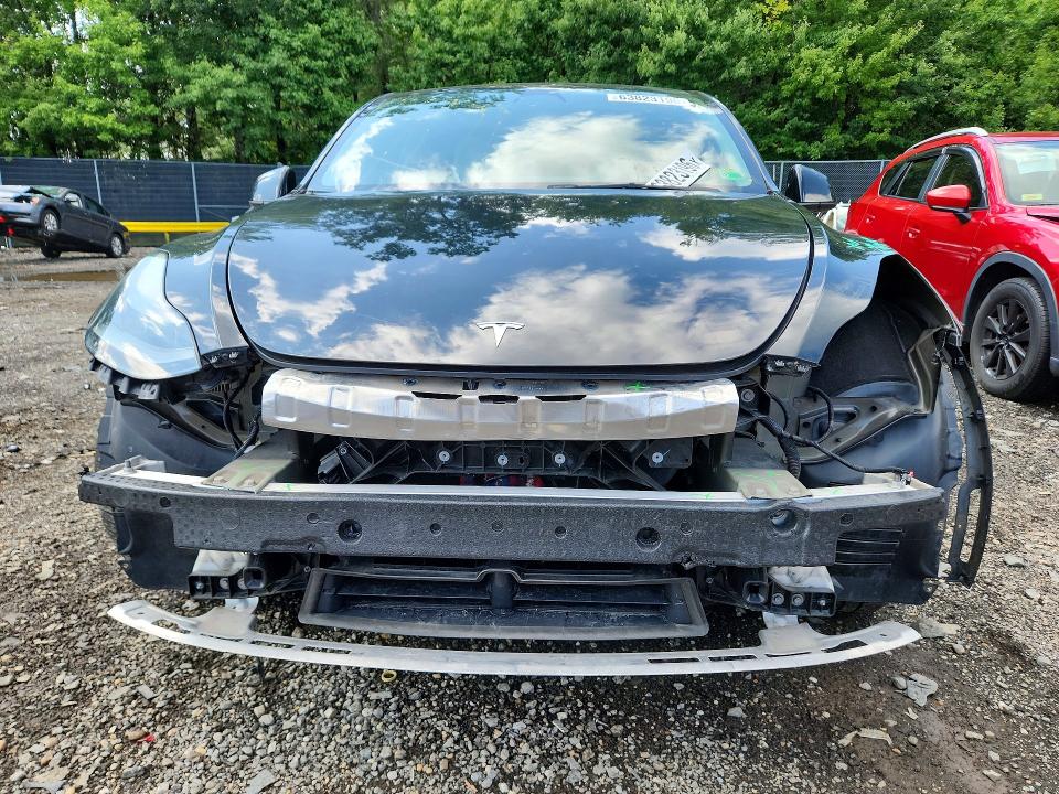 Photo 5 from auction – 2022 TESLA MODEL Y with VIN 7SAYGDEF2NF546653
