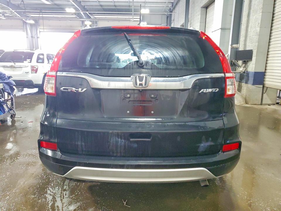 Photo 6 from auction – 2016 HONDA CR-V with VIN 2HKRM4H76GH679581