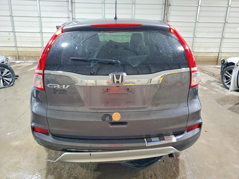 Photo 6 from auction – 2015 HONDA CR-V with VIN 3CZRM3H56FG711083