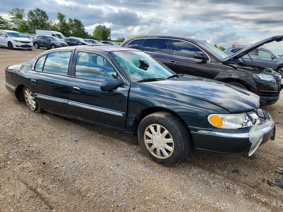 Photo 4 from auction – 2002 LINCOLN CONTINENTAL with VIN 1LNHM97V02Y672590