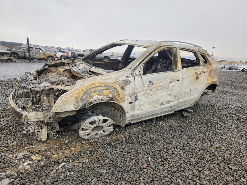 CADILLAC SRX 2012 with VIN 3GYFNGE31CS659090 - Photo from auction