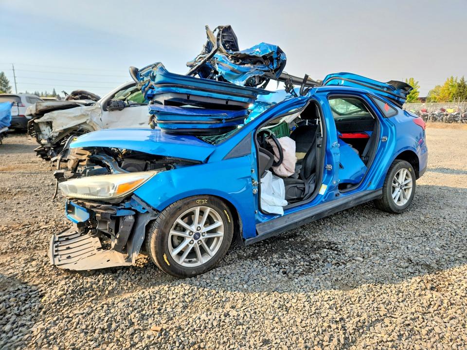 FORD FOCUS 2015 with VIN 1FADP3F27FL358538 - Photo from auction