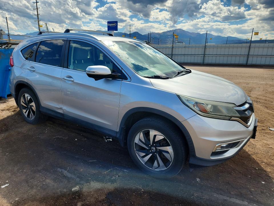 Photo 4 from auction – 2015 HONDA CR-V with VIN 5J6RM4H92FL107283
