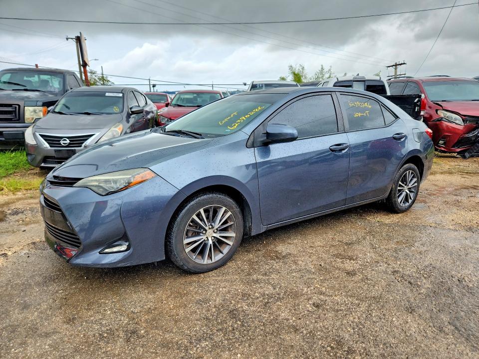 TOYOTA COROLLA 2018 with VIN 5YFBURHE8JP819749 - Photo from auction