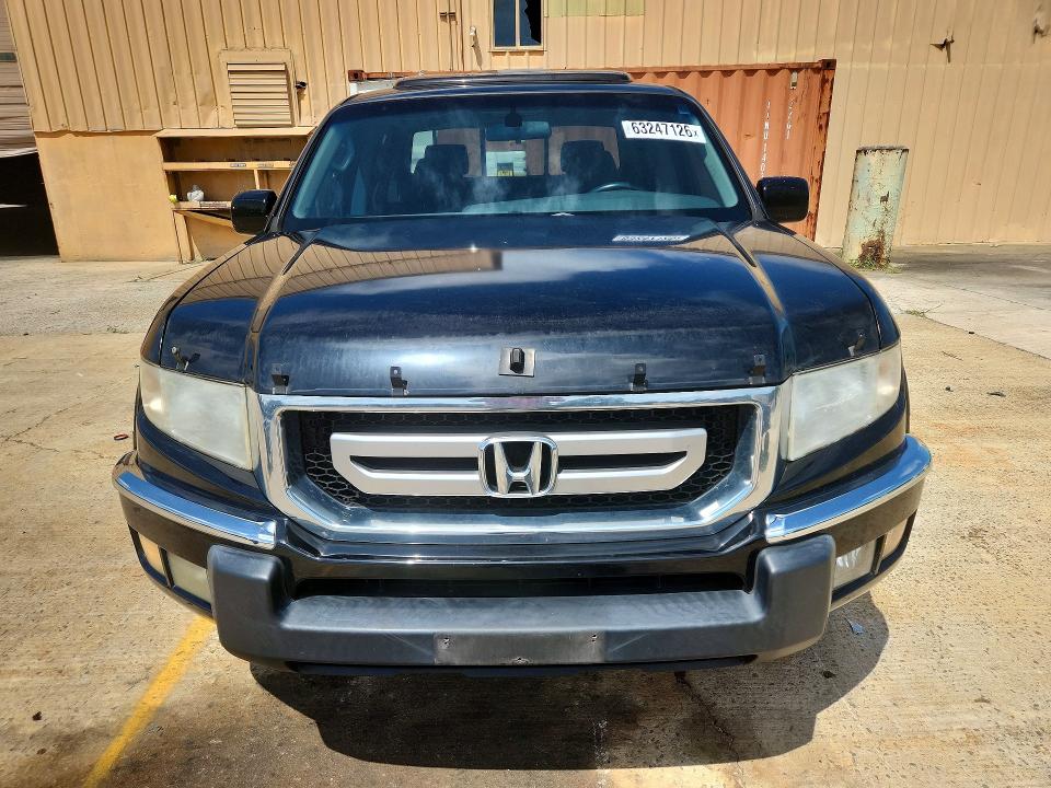 Photo 5 from auction – 2011 HONDA RIDGELINE with VIN 5FPYK1F50BB009847