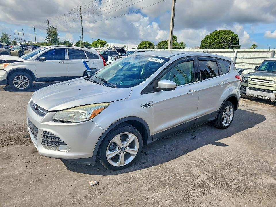 FORD ESCAPE 2014 with VIN 1FMCU0GX7EUD98727 - Photo from auction