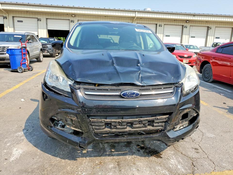 Photo 5 from auction – 2016 FORD ESCAPE with VIN 1FMCU9G96GUA32590