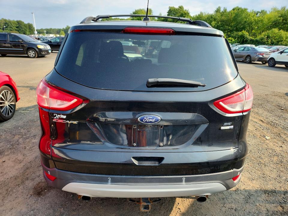 Photo 6 from auction – 2014 FORD ESCAPE with VIN 1FMCU9G98EUE04749