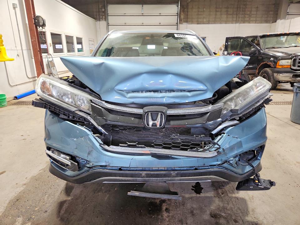 Photo 5 from auction – 2016 HONDA CR-V with VIN 2HKRM4H77GH694705