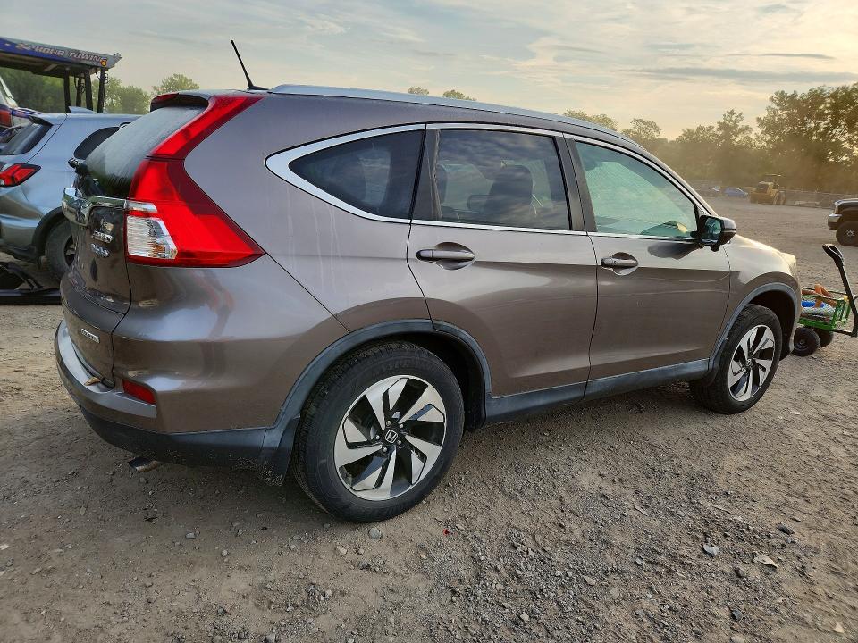 Photo 3 from auction – 2015 HONDA CR-V with VIN 5J6RM4H96FL009700