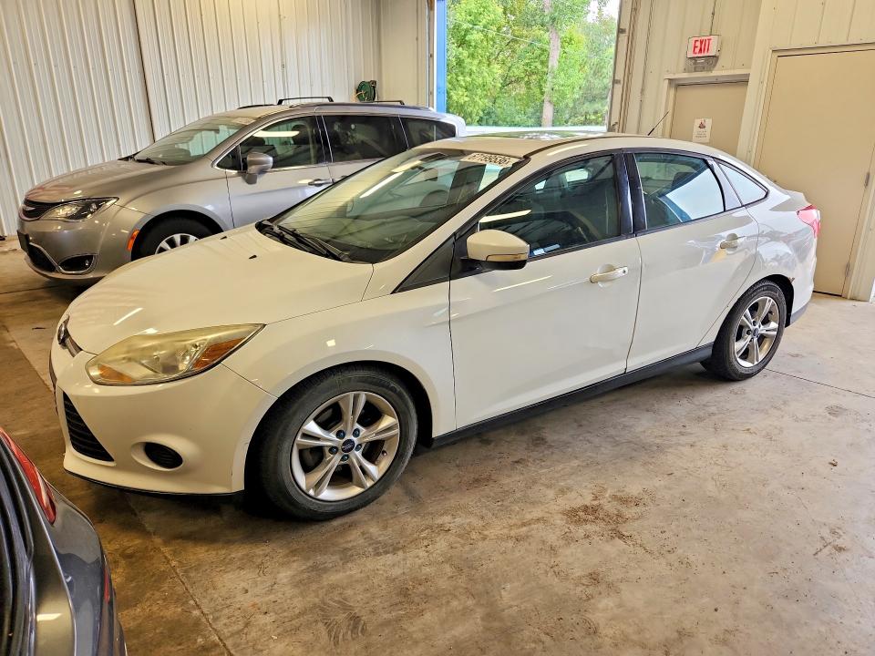FORD FOCUS 2014 with VIN 1FADP3F22EL277090 - Photo from auction