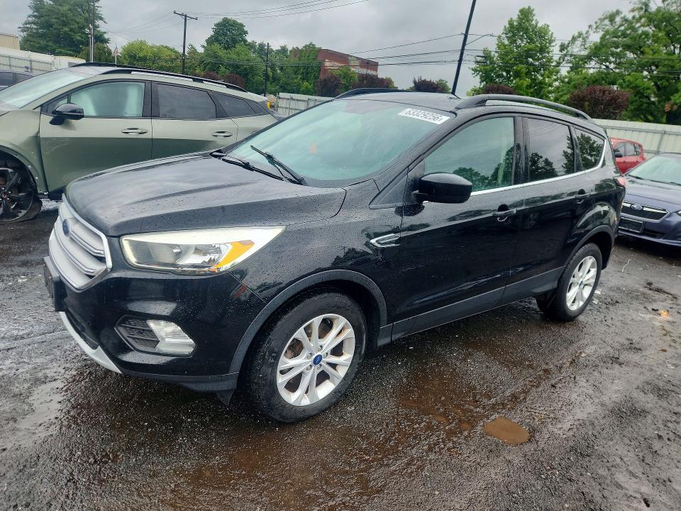 FORD ESCAPE 2018 with VIN 1FMCU9GDXJUB17136 - Photo from auction