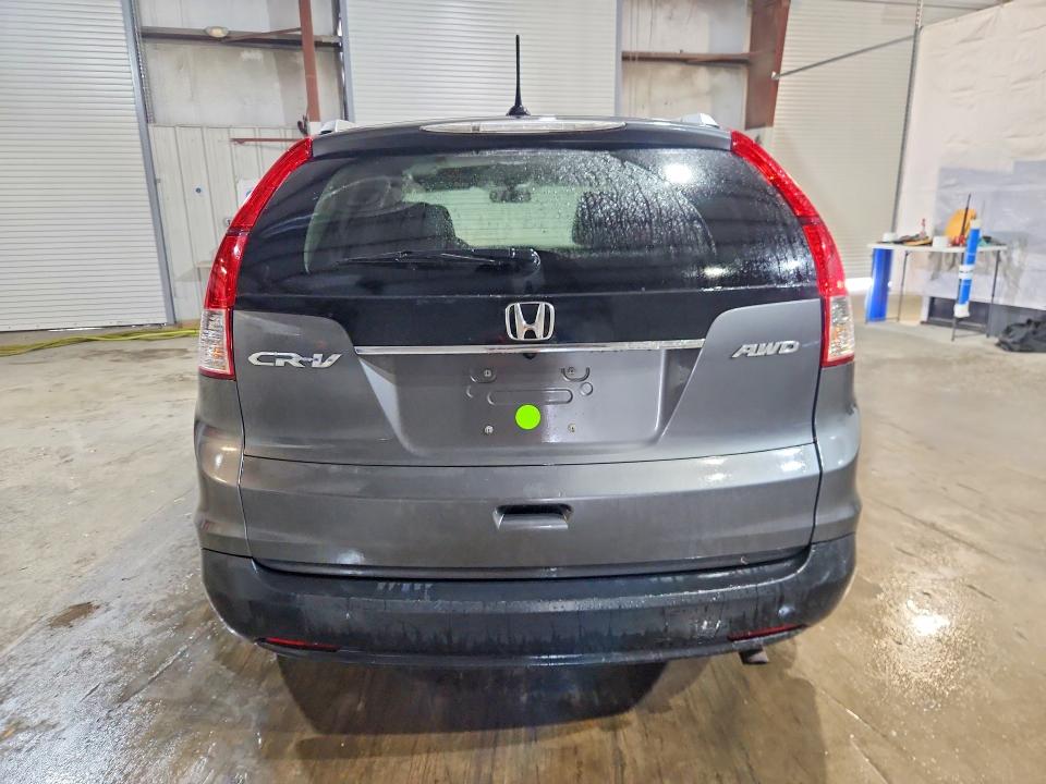 Photo 6 from auction – 2013 HONDA CR-V with VIN 2HKRM4H79DH611352