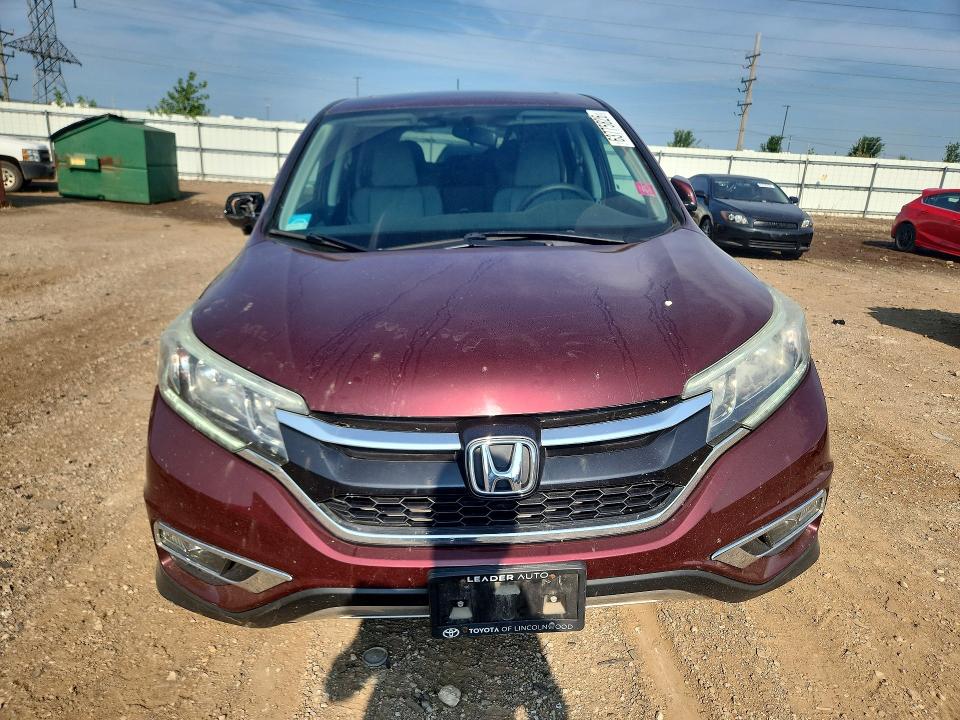 Photo 5 from auction – 2015 HONDA CR-V with VIN 2HKRM4H57FH674659