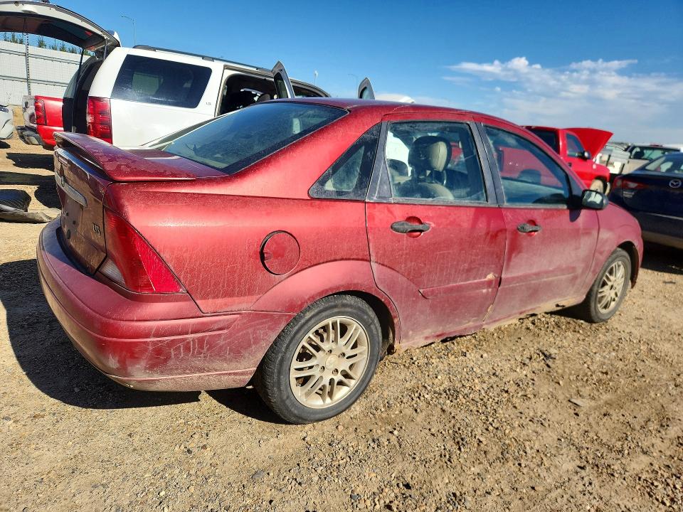 Photo 3 from auction – 2000 FORD FOCUS with VIN 1FAFP3836YW179097
