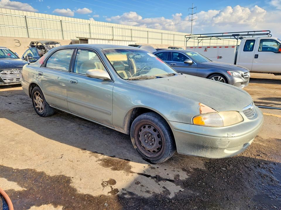 Снимка 4 от търг – 1999 MAZDA 626 с VIN 1YVGF22D4X5901243