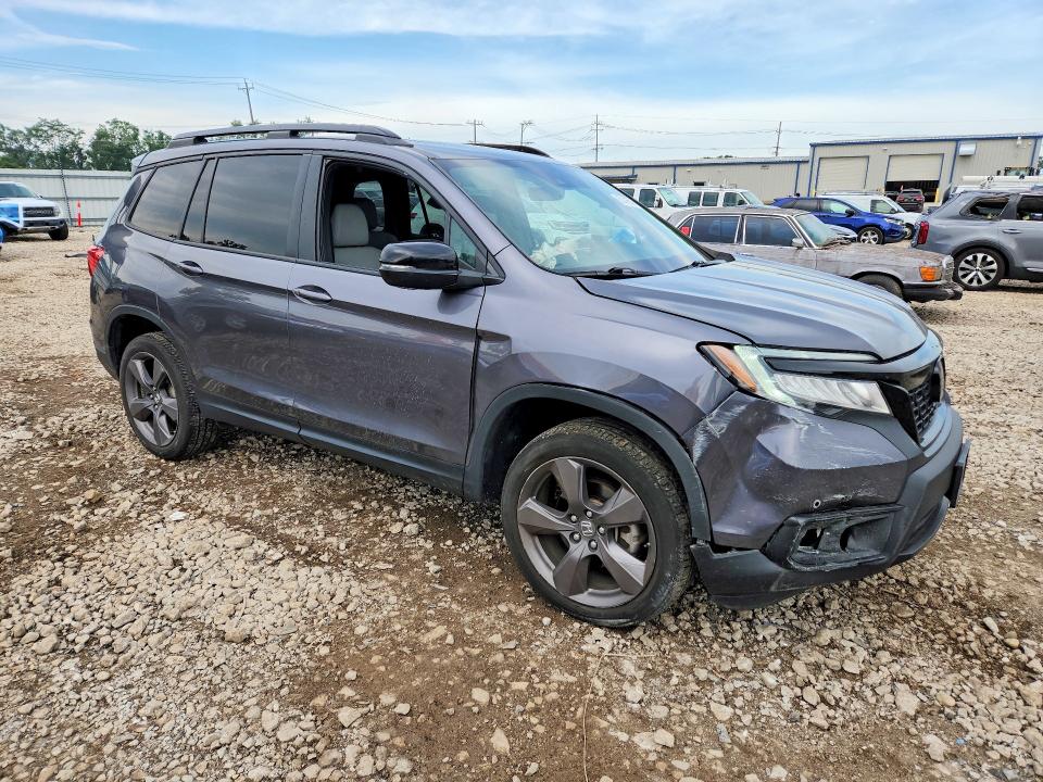 Photo 4 from auction – 2021 HONDA PASSPORT with VIN 5FNYF8H93MB010533