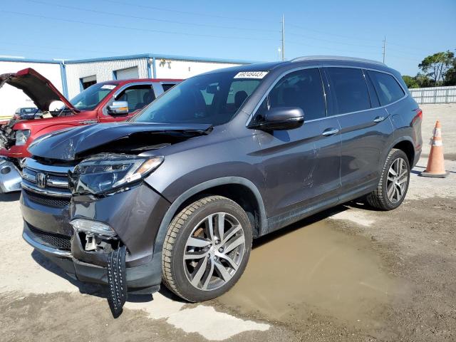HONDA PILOT ELIT 2017 with VIN 5FNYF6H05HB068400 - Photo from auction