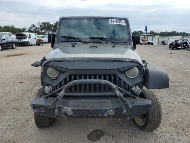 Photo 5 from auction – 2016 JEEP WRANGLER U with VIN 1C4BJWDG0GL182808