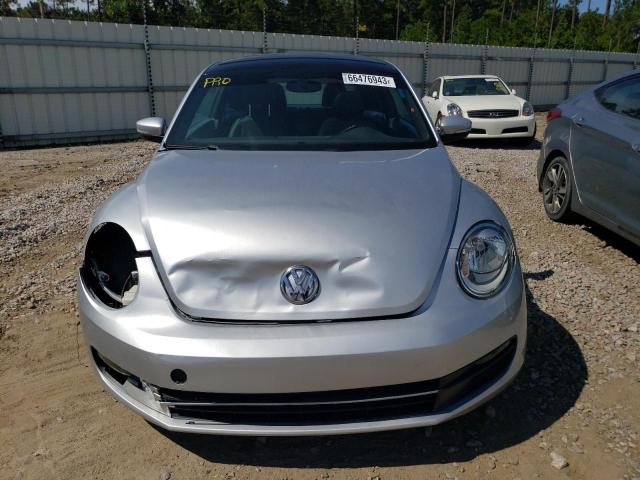 Photo 5 from auction – 2014 VOLKSWAGEN BEETLE with VIN 3VWJP7AT2EM628189
