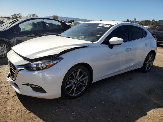 MAZDA 3 TOURING 2018 with VIN 3MZBN1L3XJM165474 - Photo from auction