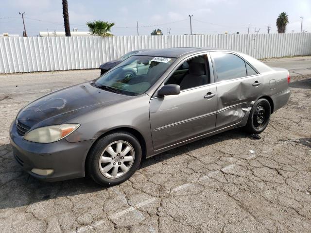 TOYOTA CAMRY LE 2003 with VIN 4T1BF32K83U554385 - Photo from auction