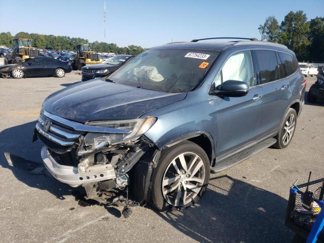 HONDA PILOT TOUR 2016 with VIN 5FNYF6H99GB054044 - Photo from auction