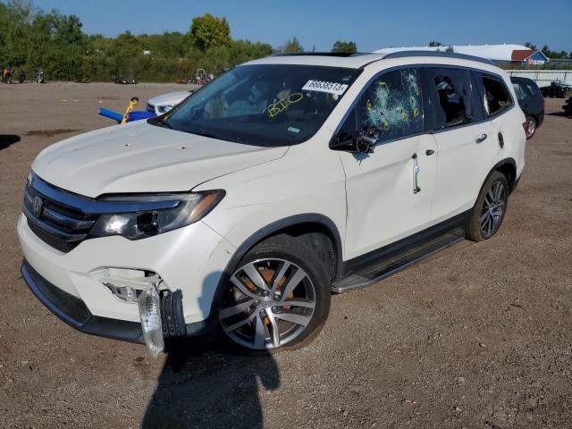 HONDA PILOT TOUR 2016 with VIN 5FNYF5H91GB052668 - Photo from auction