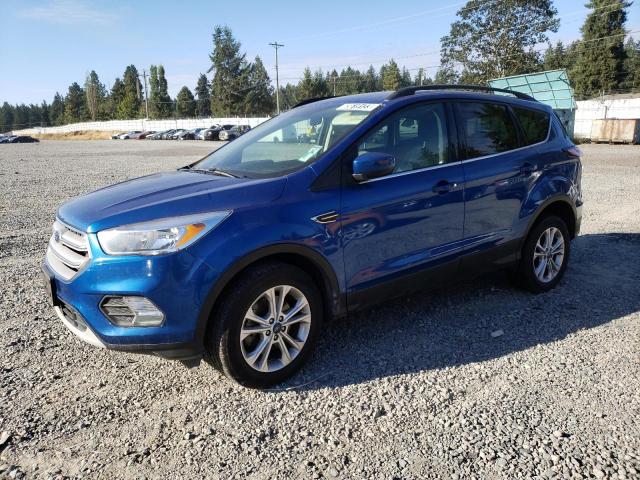 FORD ESCAPE SE 2018 with VIN 1FMCU9GD4JUC11688 - Photo from auction
