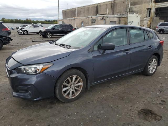 SUBARU IMPREZA 2017 with VIN 4S3GTAA66H3712098 - Photo from auction