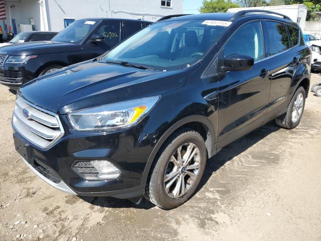 FORD ESCAPE SE 2018 with VIN 1FMCU9GD2JUA26345 - Photo from auction